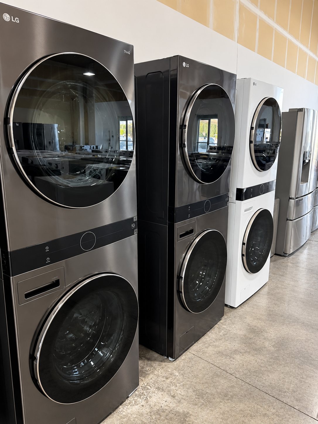 LG washer and dryer display units in showroom with stacked configurations